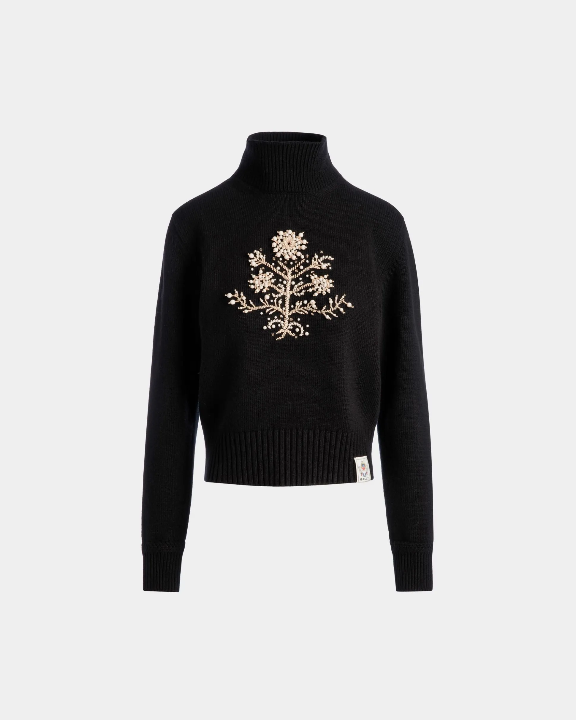 Winter Capsule Rollkragenpullover Aus Schwarzer Wolle Mit Einer Heritage-Blume